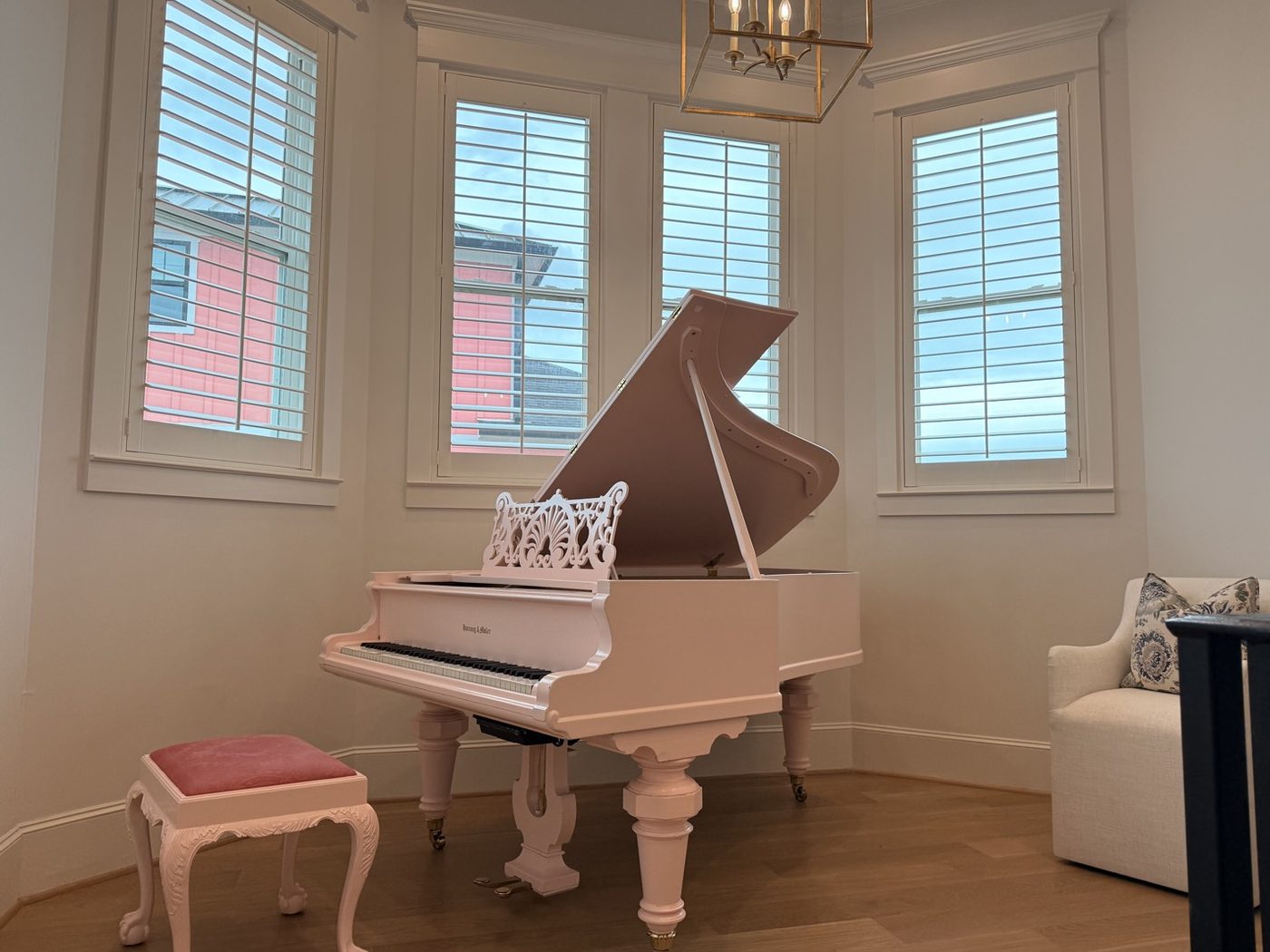 White plantation shutters across a bay of windows